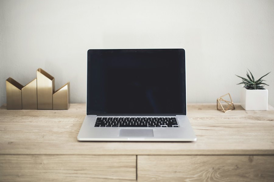 A laptop on a wooden desk (stock photo)